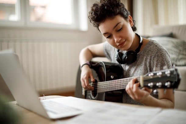 Teenager singing a song for grandparents via video chat on national grandparents day